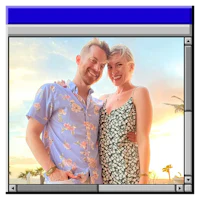 a man and woman posing in front of a sunset