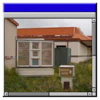 a computer screen showing a sign in front of a building