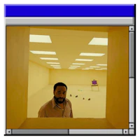 a man standing in a room with a computer screen